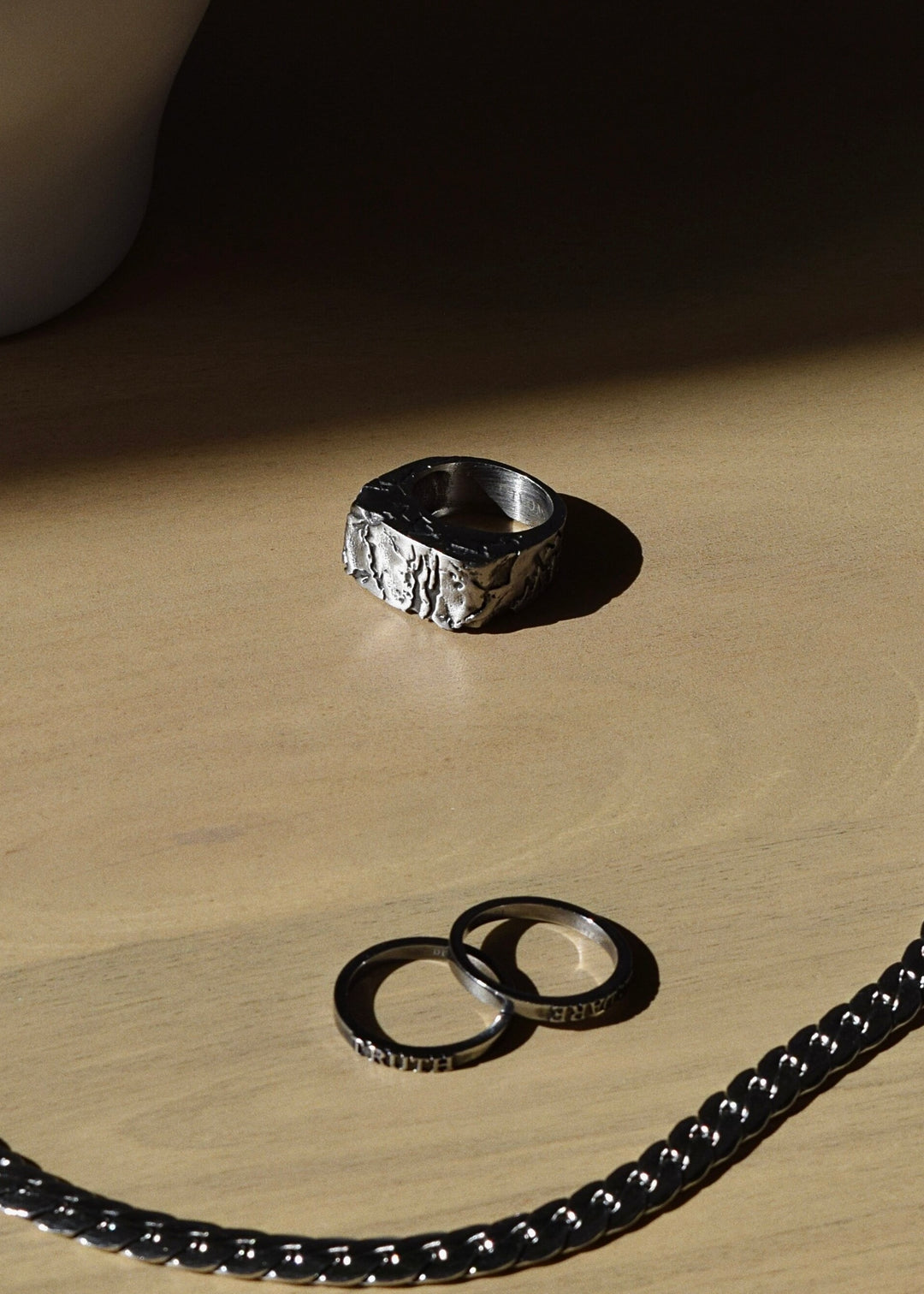 Side profile of handcrafted Cracked Chunky Silver Ring highlighting its thickness.