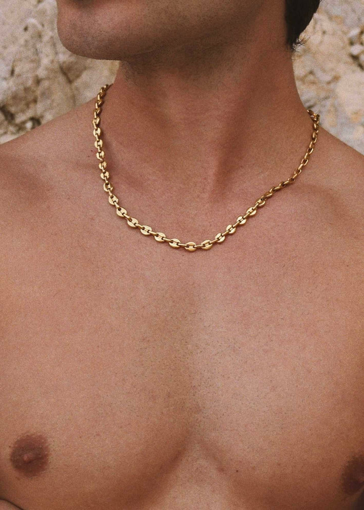6mm gold chain necklace by DIVON – Marina link style worn close to collarbone
