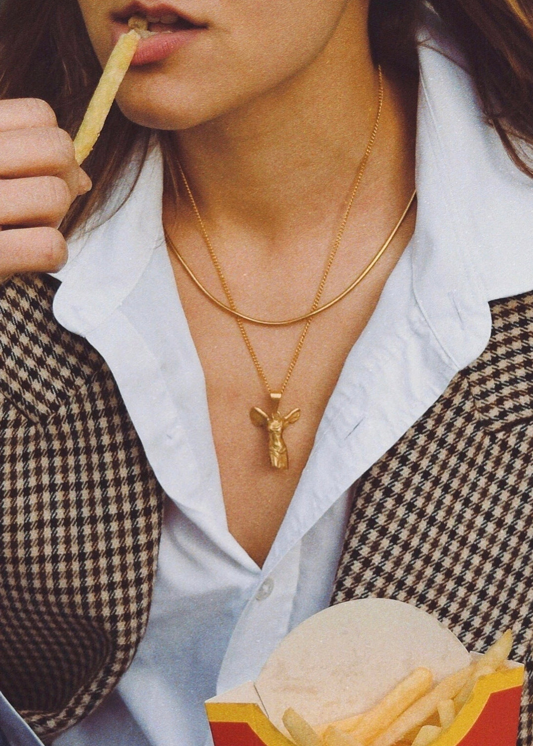 Women wearing The Winged Victory of Samothrace Gold necklace