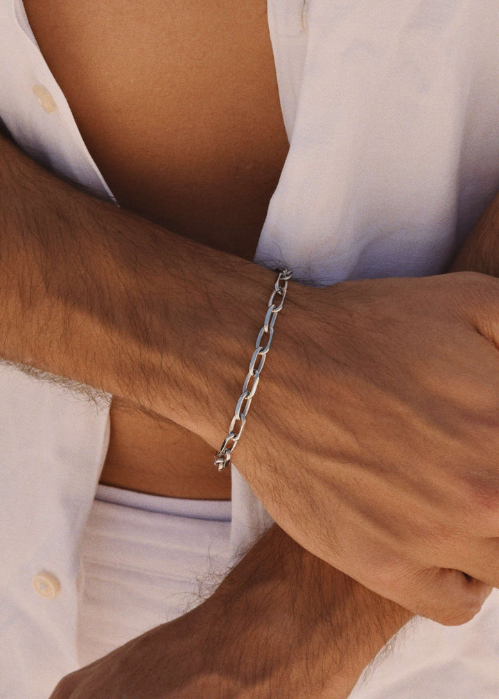 Close-up of silver anchor bracelet worn on wrist – waterproof and tarnish-free 5mm chain by DIVON